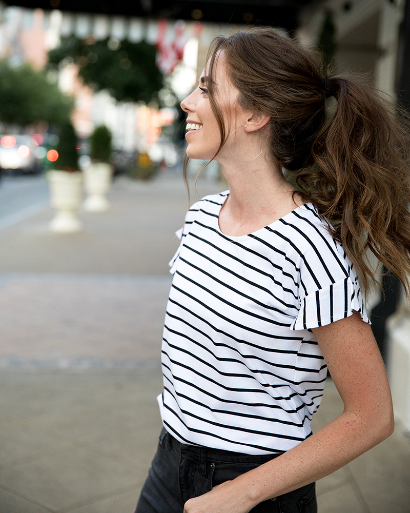 Woman in the city wearing striped short sleeve shirt