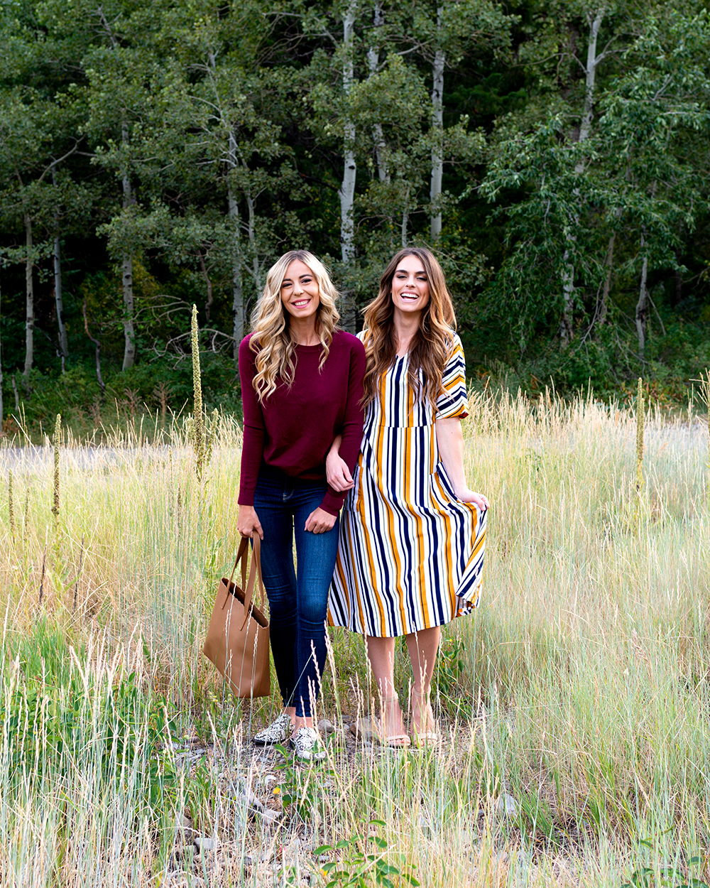 2 women in a field wearing modest fashion