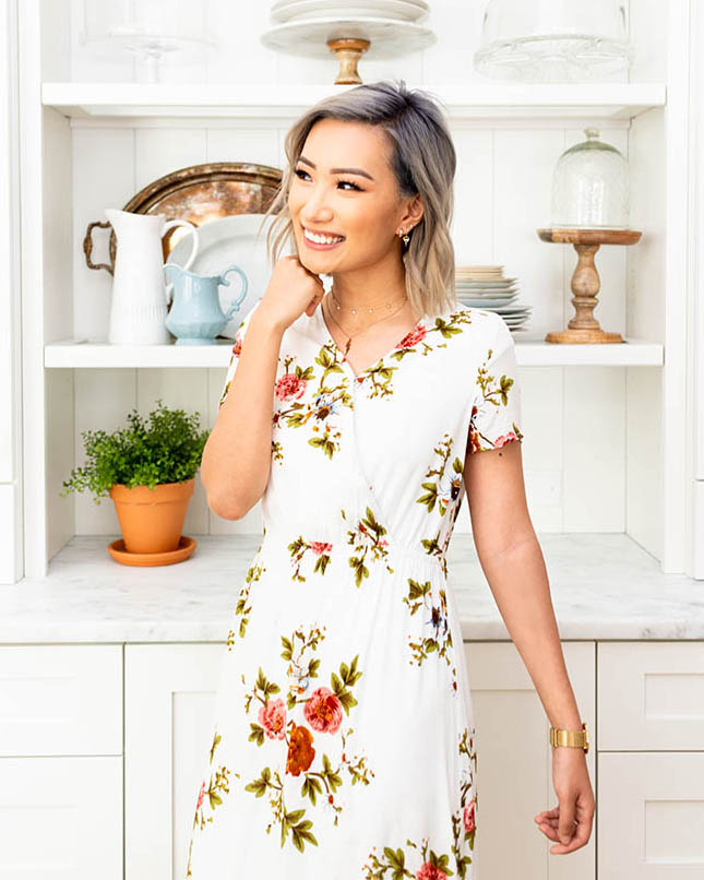 Woman in floral wrap dress.