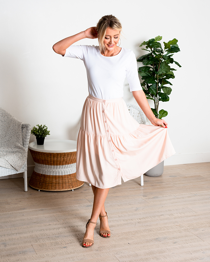 Woman in pink button up skirt